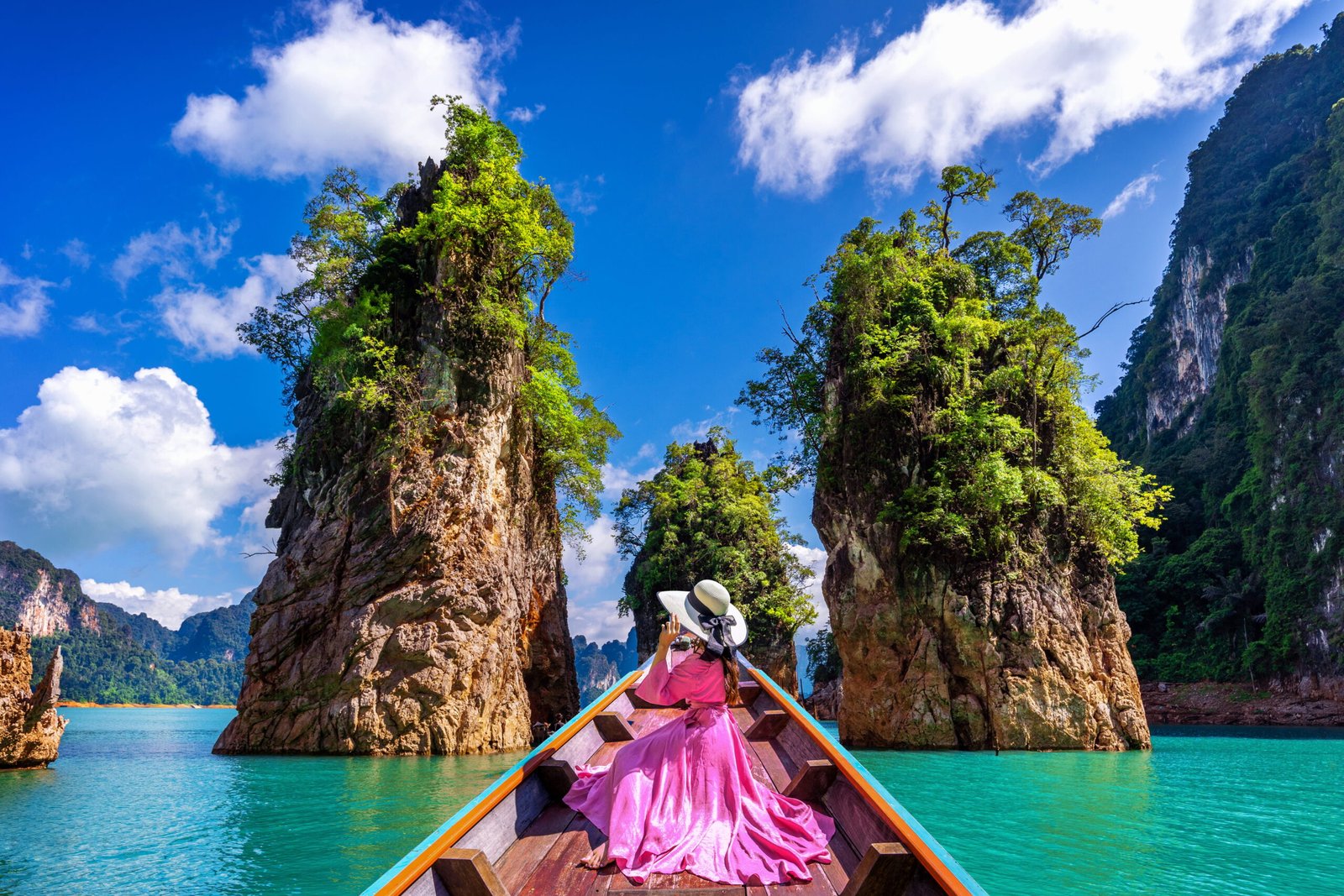beautiful-girl-sitting-boat-looking-mountains-ratchaprapha-dam-khao-sok-national-park-surat-thani-province-thailand